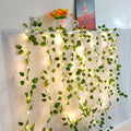 Guirnalda de luces con hojas verdes y flores, luces de hadas con enredadera artificial, alimentada por pilas, para árbol de Navidad y decoración del hogar